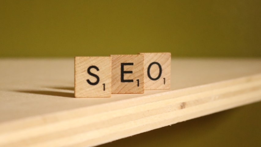 Wooden cubes spelling out the term “SEO.”