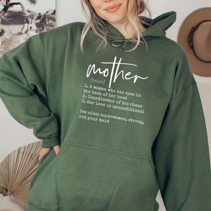 A green hoodie with a Mother's Day design defining a mother in a clever way.