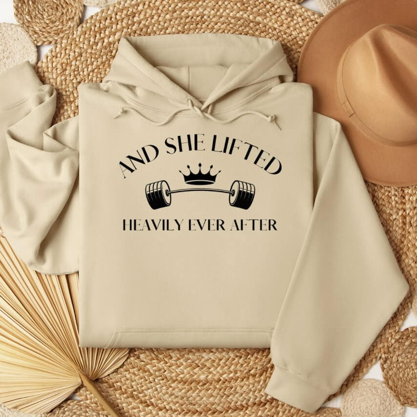 A clever gym-inspired hoodie design that says "And she lifted happily ever after."