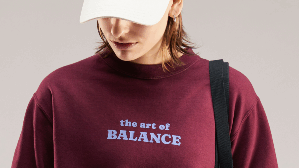 Unisex midweight softstyle fleece crewneck sweatshirt Sweatshirt featuring the phrase "The Art of Balance" in stylish typography on a neutral background.