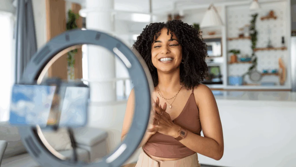 An influencer recording a video on her phone.