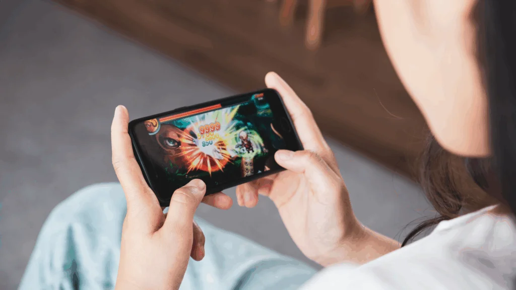 A person is playing games on the phone.