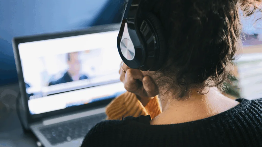 A person is watching a video on a laptop.