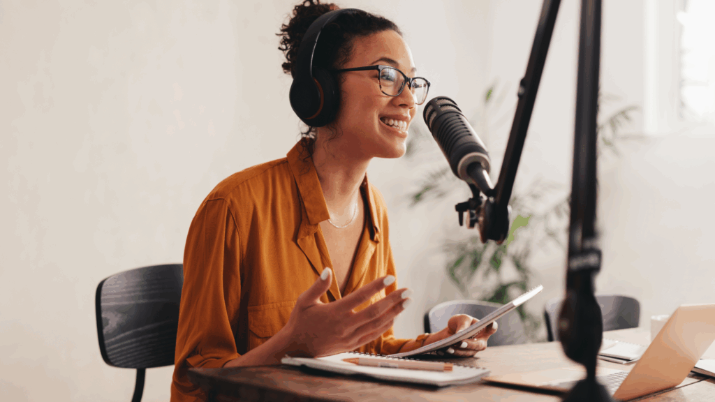 A woman is recording a podcast.