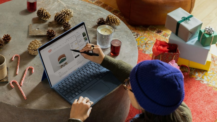 How to find what templates to sell A person sitting and working on a laptop.