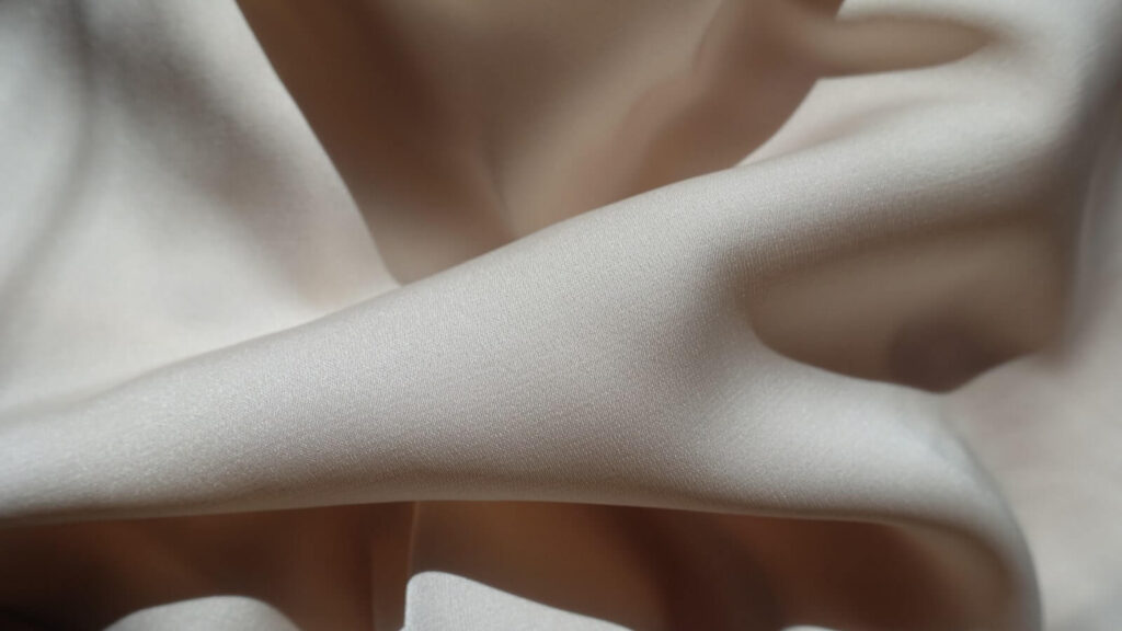 Ivory viscose fabric.