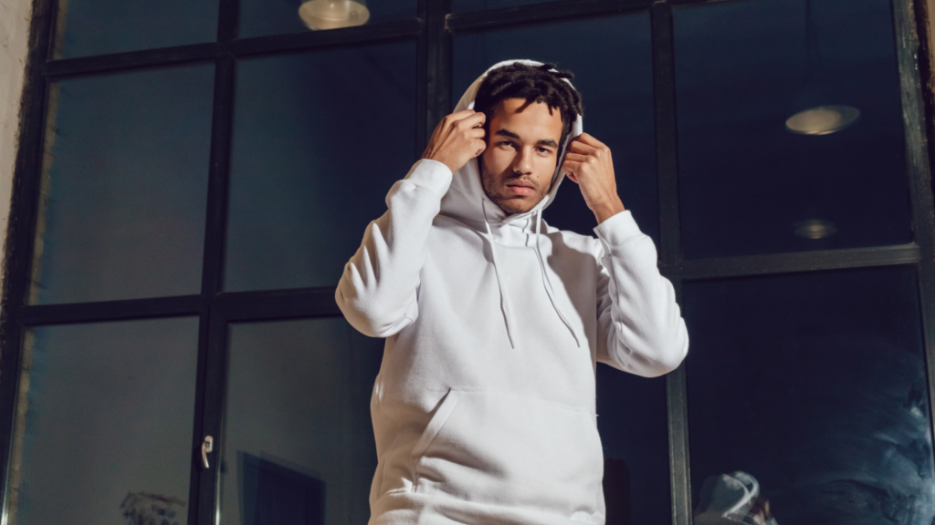 A person with a white hoodie on.