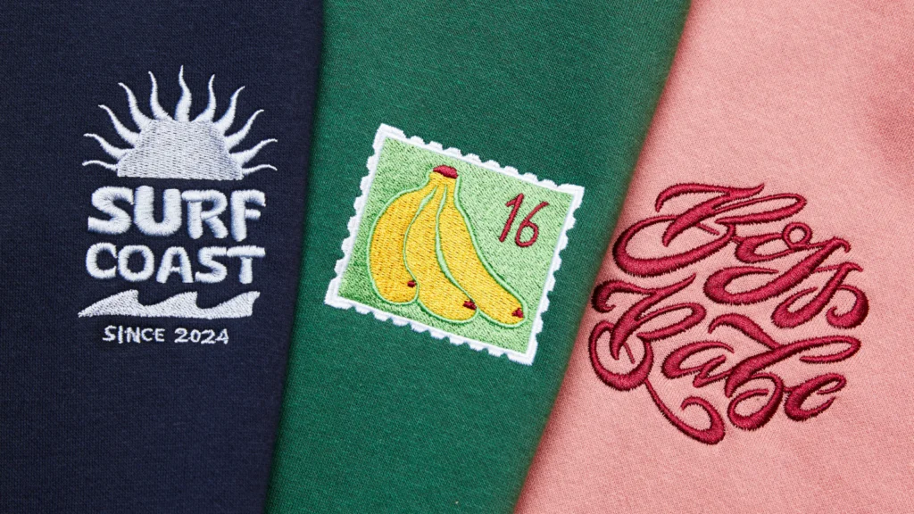 A navy patch with a sun and "Surf Coast Since 2024," a green patch with a banana stamp and "16," and a pink patch with "Boss Babe".