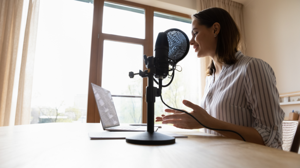A woman voice actress recording.