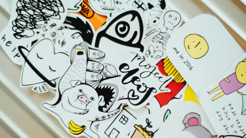 Custom stickers Dropshipping business ideas An assortment of stickers on a white wall, highlighting diverse patterns and vibrant colors.