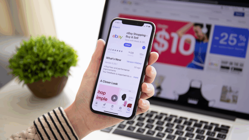 Amazon alternatives A person holding a phone with an eBay app on it.