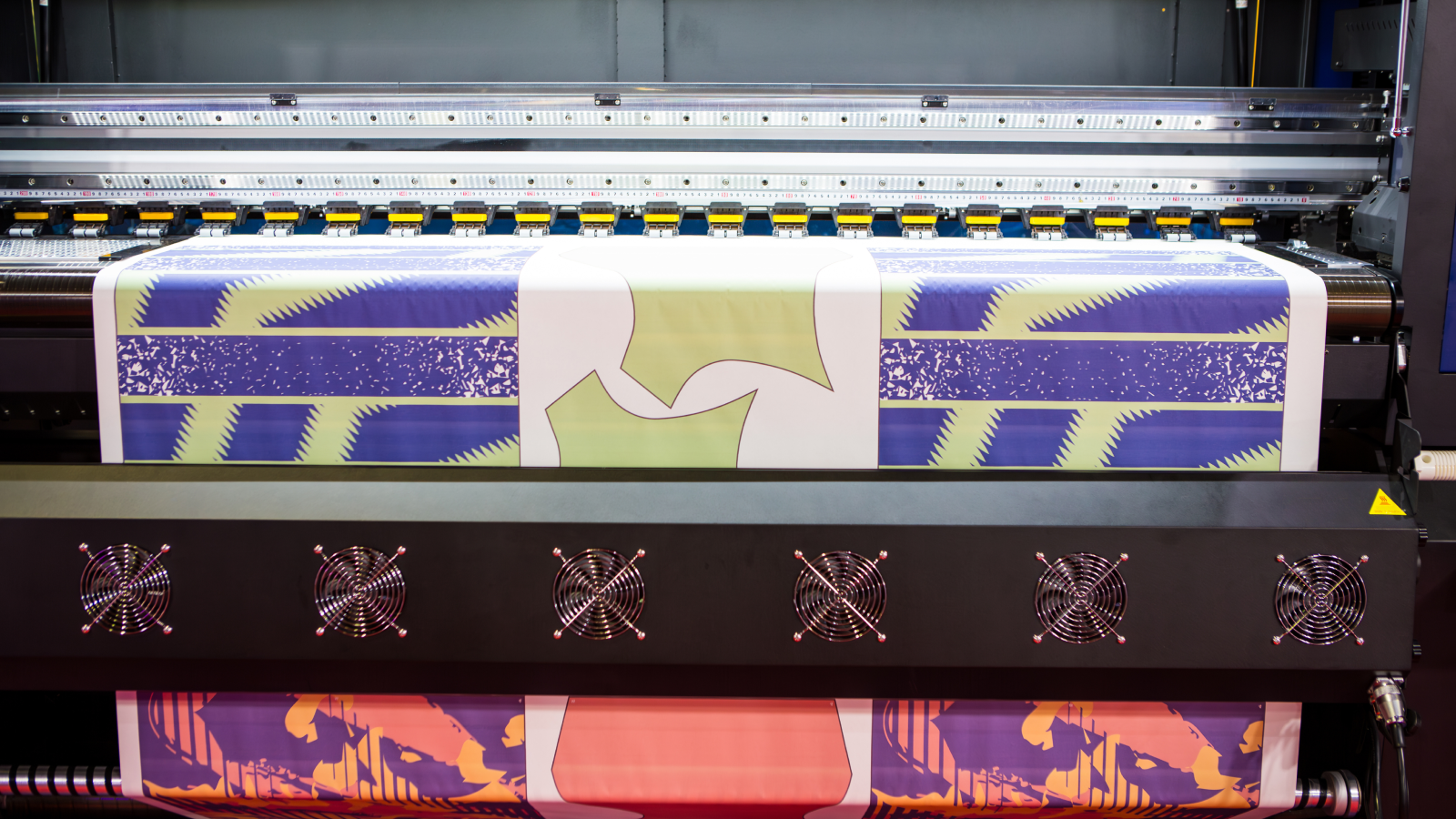 Direct to film printing DTF Types of shirt printing A direct-to-film DTF) printe in the process of printing.