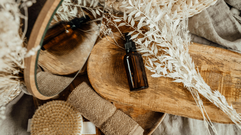 Eco friendly products What to sell on Shopify An eco-friendly beauty product on a wooden board surrounded by different bathroom accessories.