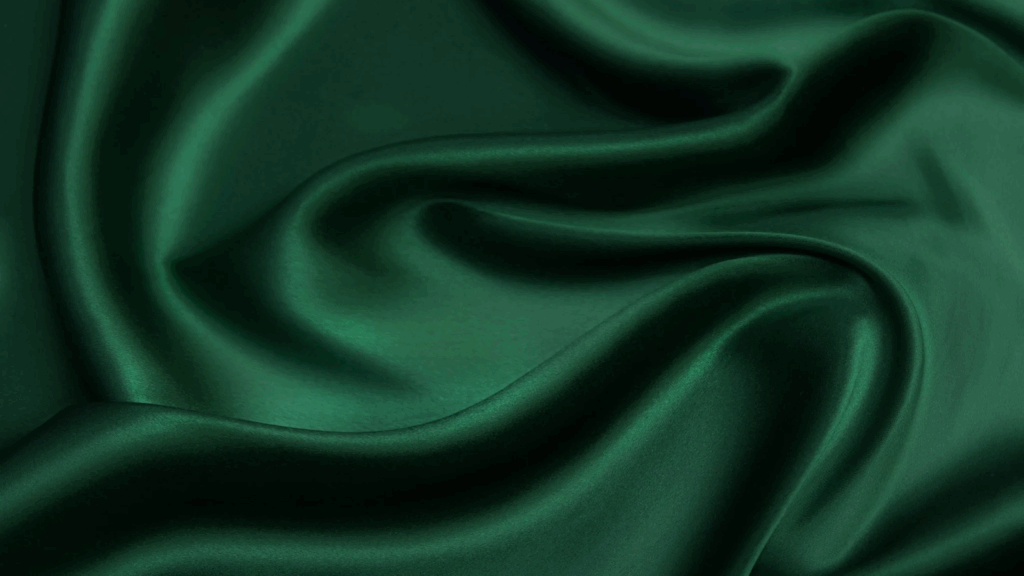 Silk Types of fabric Close-up of dark green silk with a visible weave pattern.