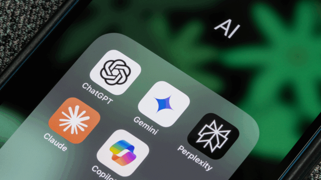 What is AI and why should it matter for small businesses An iPhone screen displaying various AI app icons arranged on the home screen.
