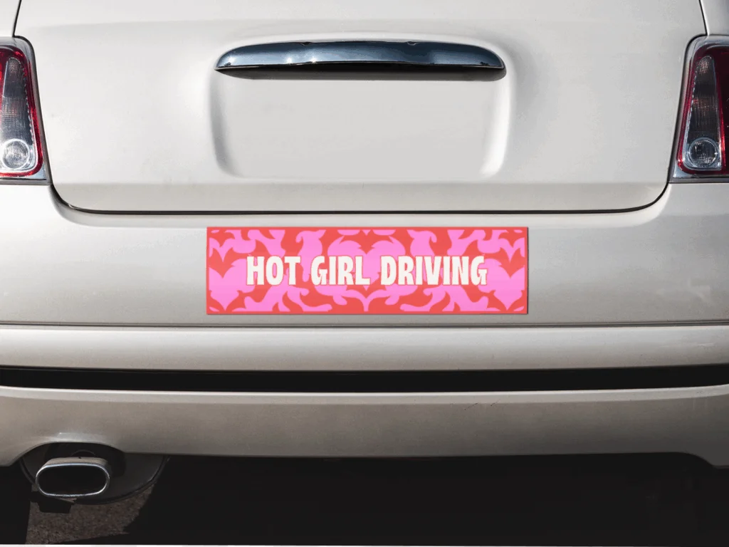 A custom “Hot girl driving” bumper sticker.