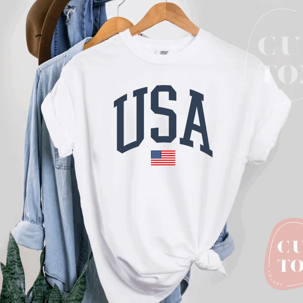 A white “USA” 4th of July-themed t-shirt.