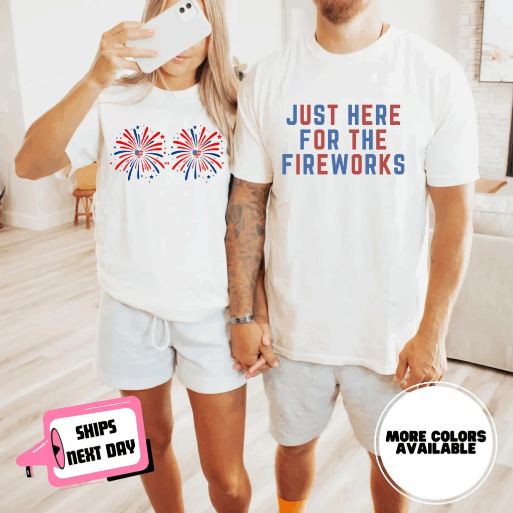 A couple wearing white 4th of July-themed t-shirts.