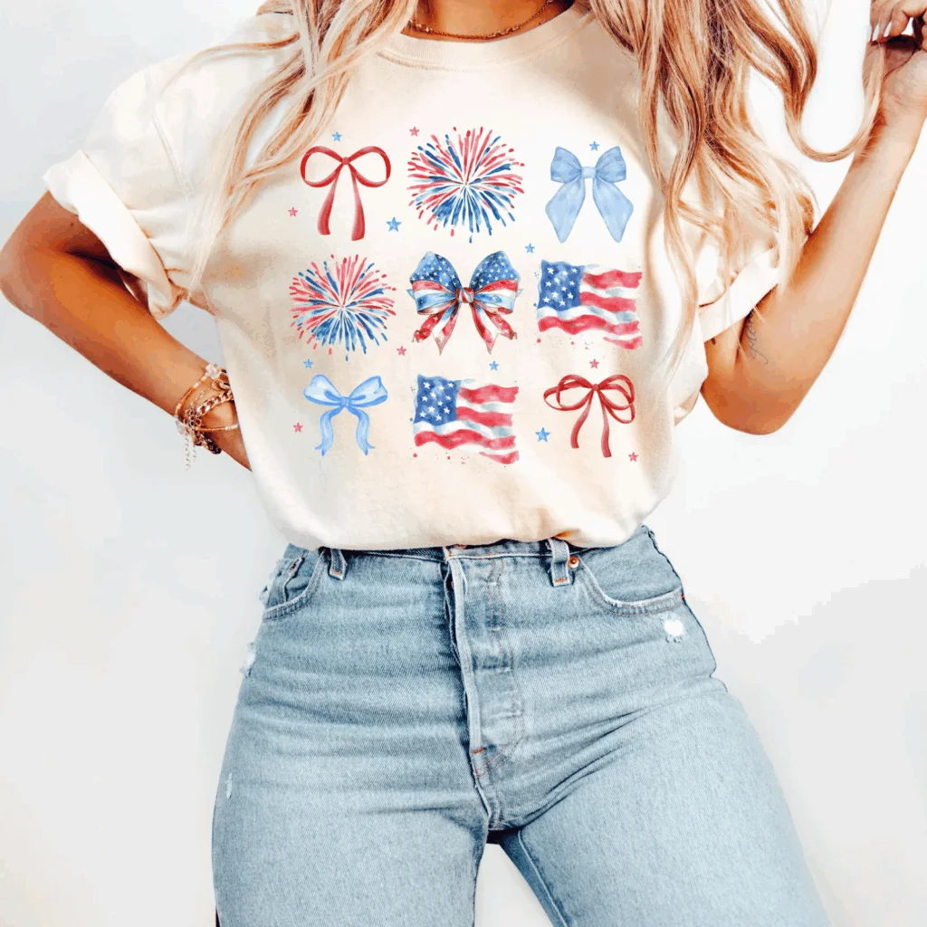 A cream-white 4th of July-themed t-shirt with various icons.