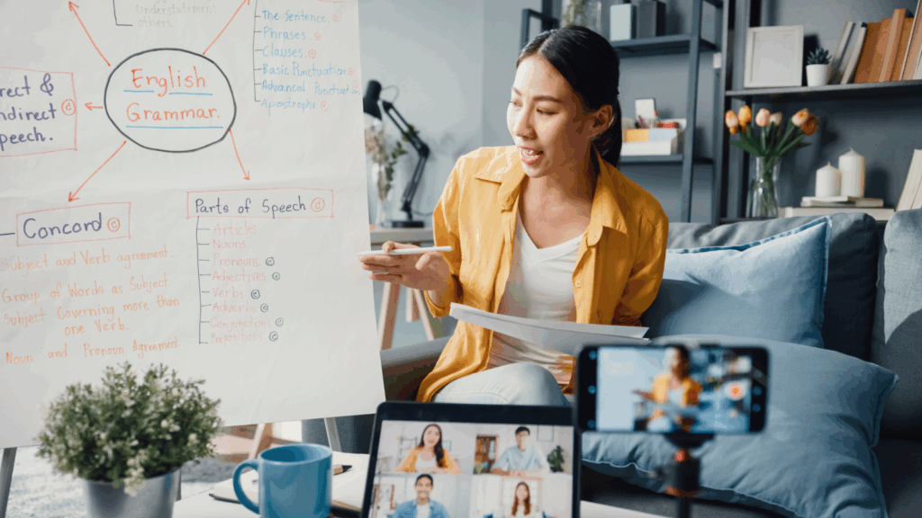 Online tutoring – Teach students virtuallyv A woman tutoring an online class.