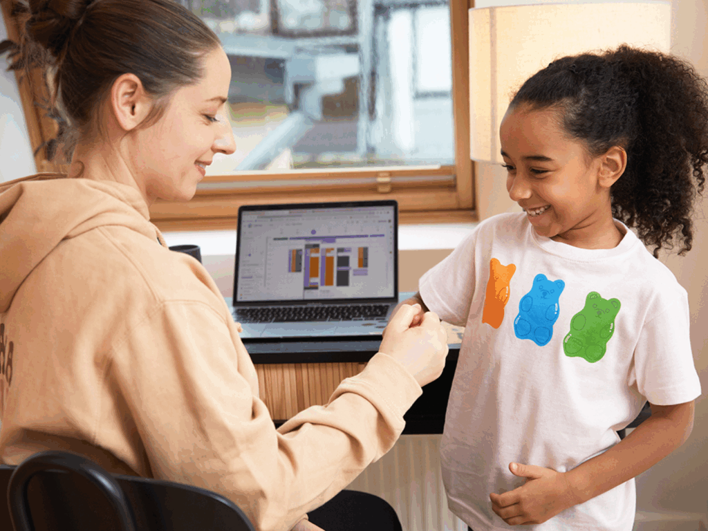 Personalize back to school products with Printify A mom and daughter shaking hands.
