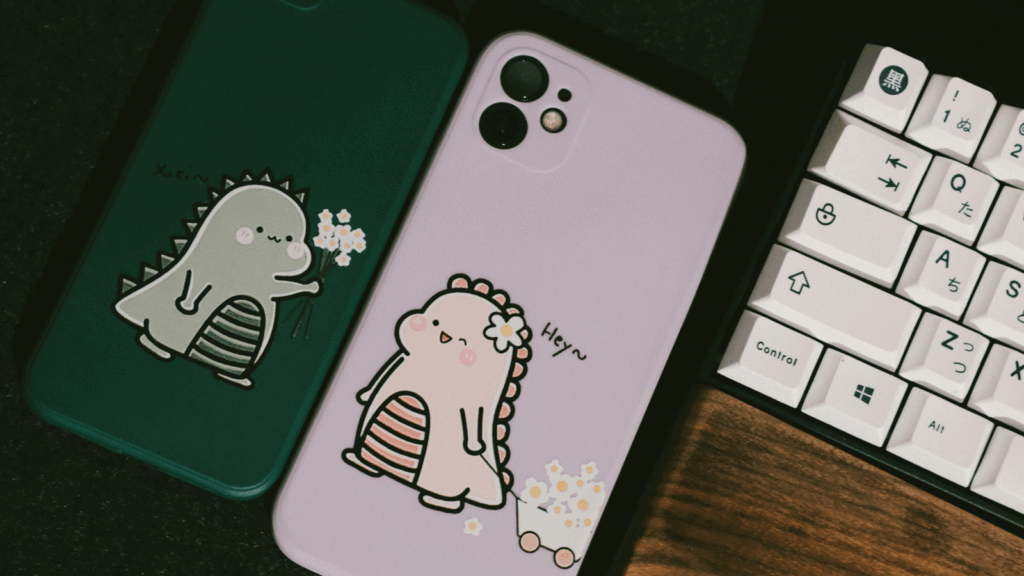 Phone cases Etsy shop ideas Two phone cases featuring a cartoon dinosaur design, showcasing vibrant colors and playful illustrations.