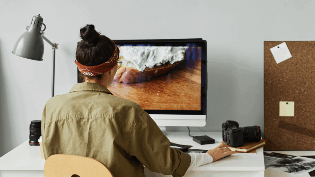 Prepare your images for printing A photographer editing images on a large monitor.