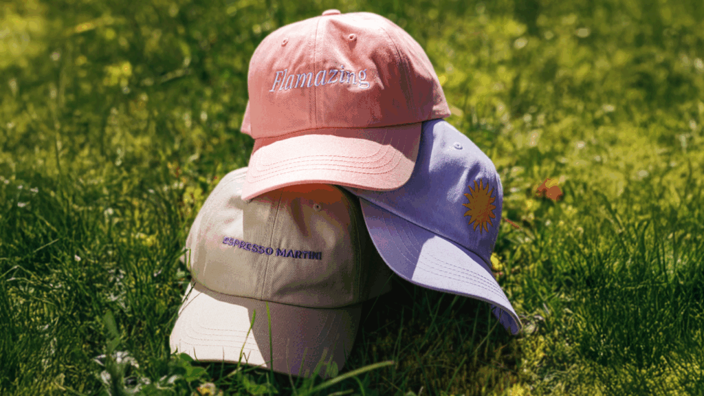 Stylish hats Make a living without a job Custom hats in various colors with embroidered logos and text.