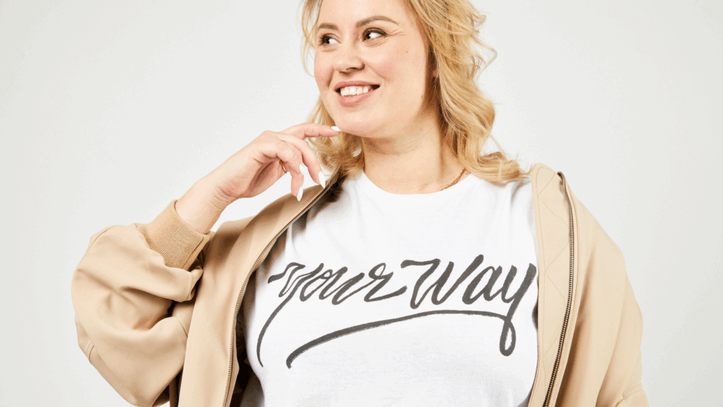 T shirts Etsy shop ideas A woman wearing a t-shirt that reads "your way," smiling and standing.