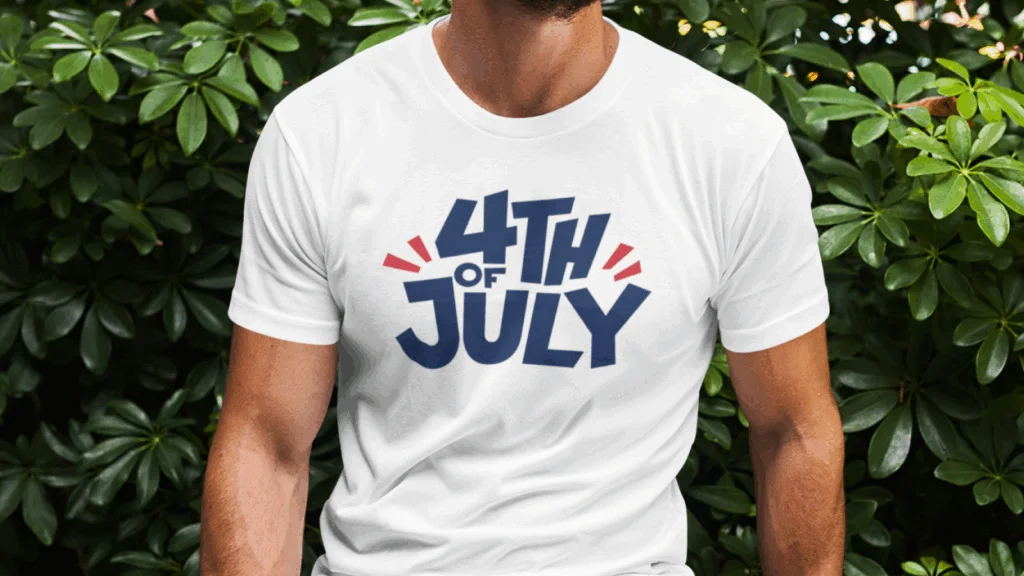 A man wearing a white “4th of July” t-shirt on a green floral background.