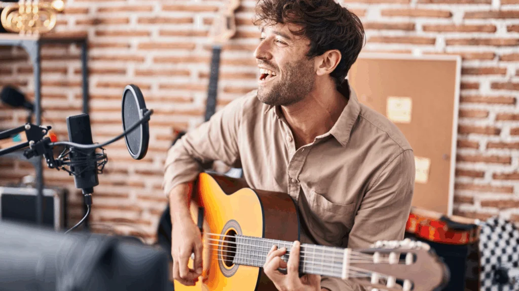 A man is playing a guitar.