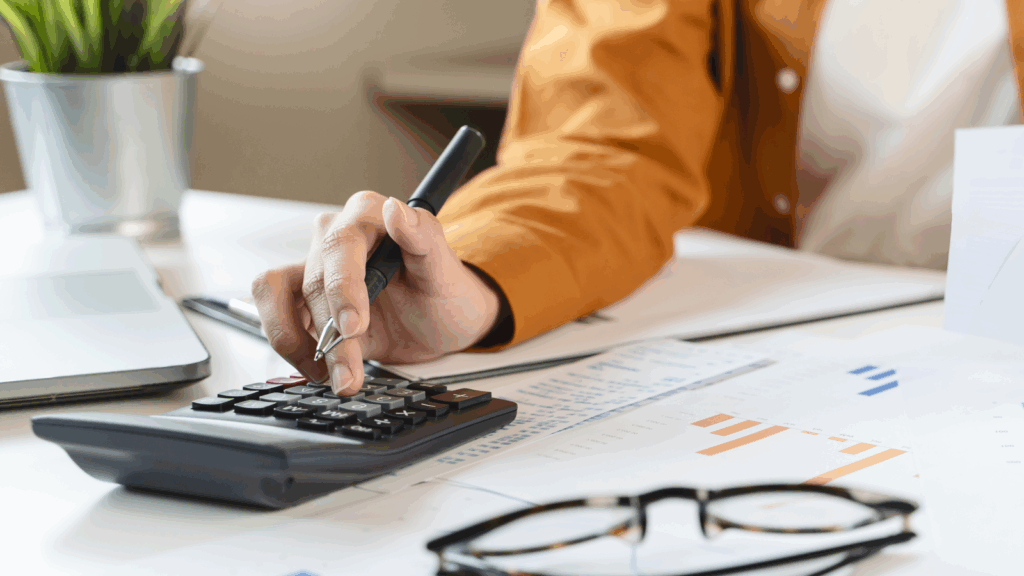 A woman using a calculator.