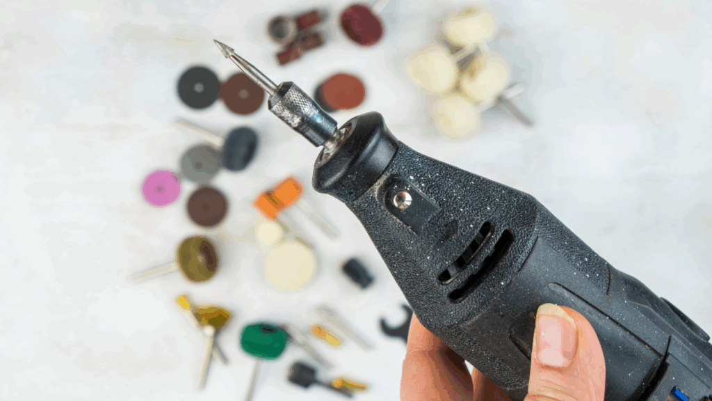 Diamond drag engraving and rotary tools A person holding an engraving tool.