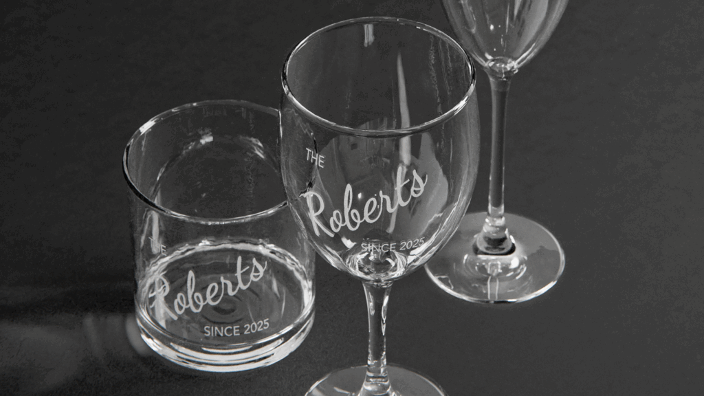 Laser engraving Different glassware with engraved “The Roberts since 2025” text.
