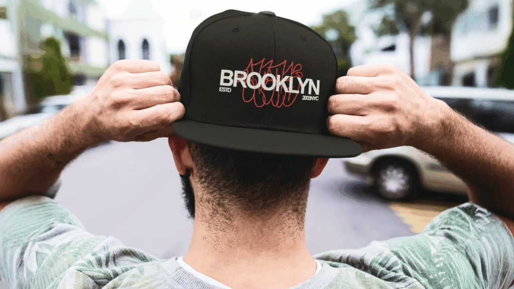 A stylish hat featuring the Brooklyn logo, showcasing a blend of urban fashion and outdoor adventure.