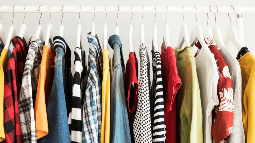 A rack displaying a variety of colorful shirts neatly hung on hangers.