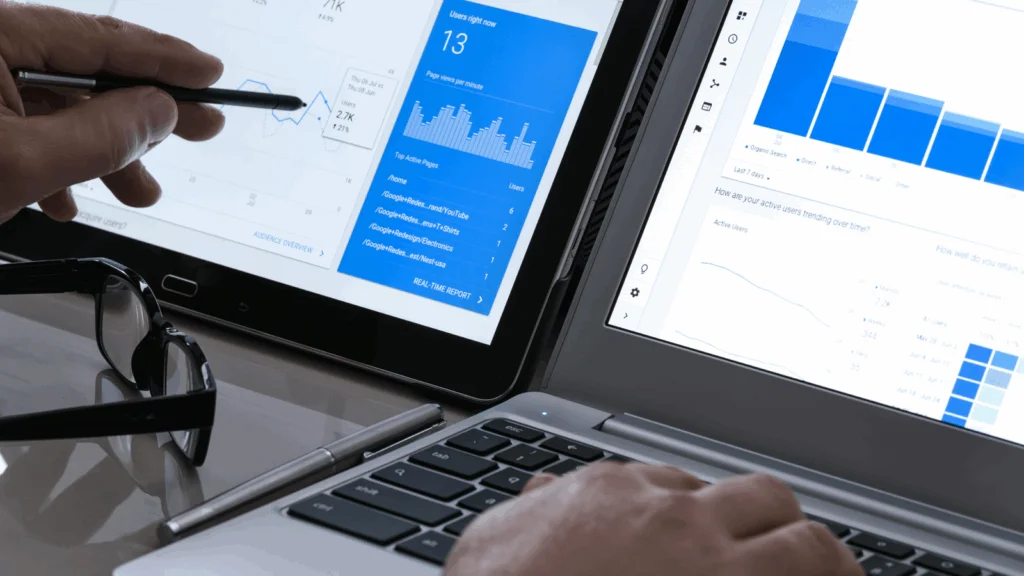 A person is working on a laptop displaying a graph, indicating data analysis or presentation.