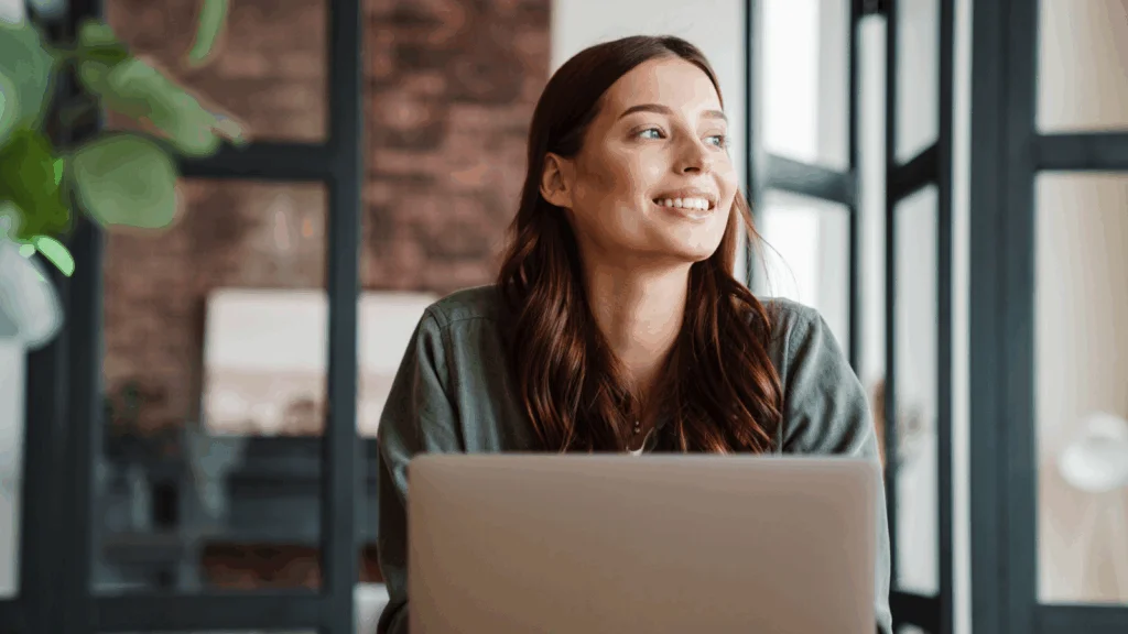 Success tips and best practices A woman working on a laptop.
