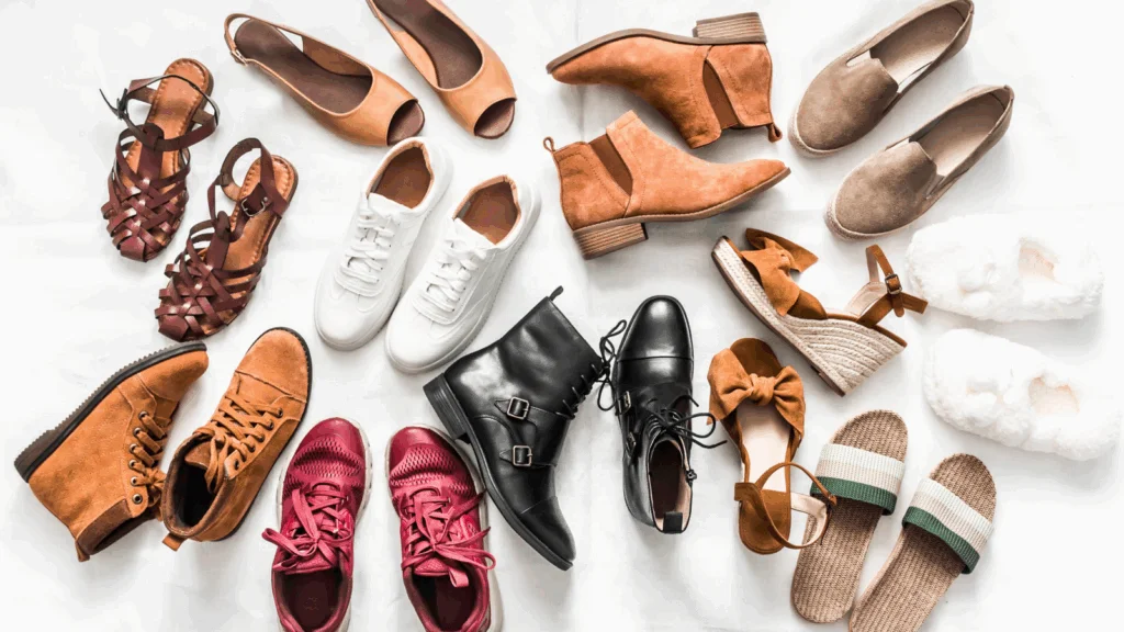 A diverse collection of women's shoes, including heels, flats, sandals, and boots, displayed together.