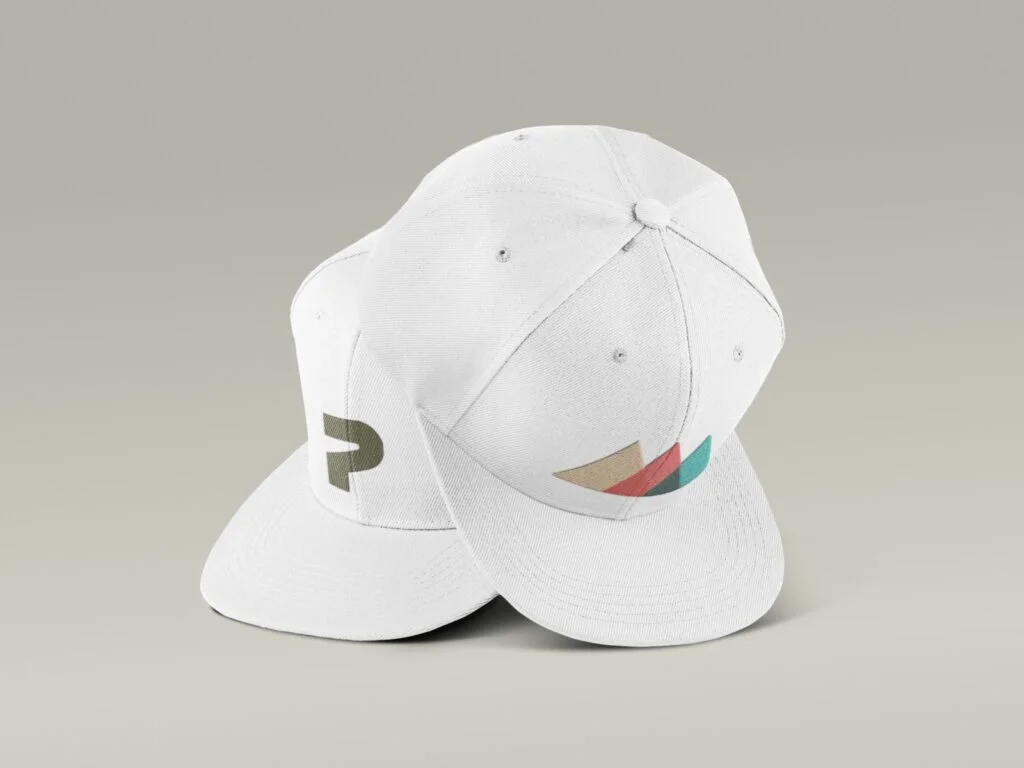 A white hat featuring a vibrant, colorful logo prominently displayed on the front