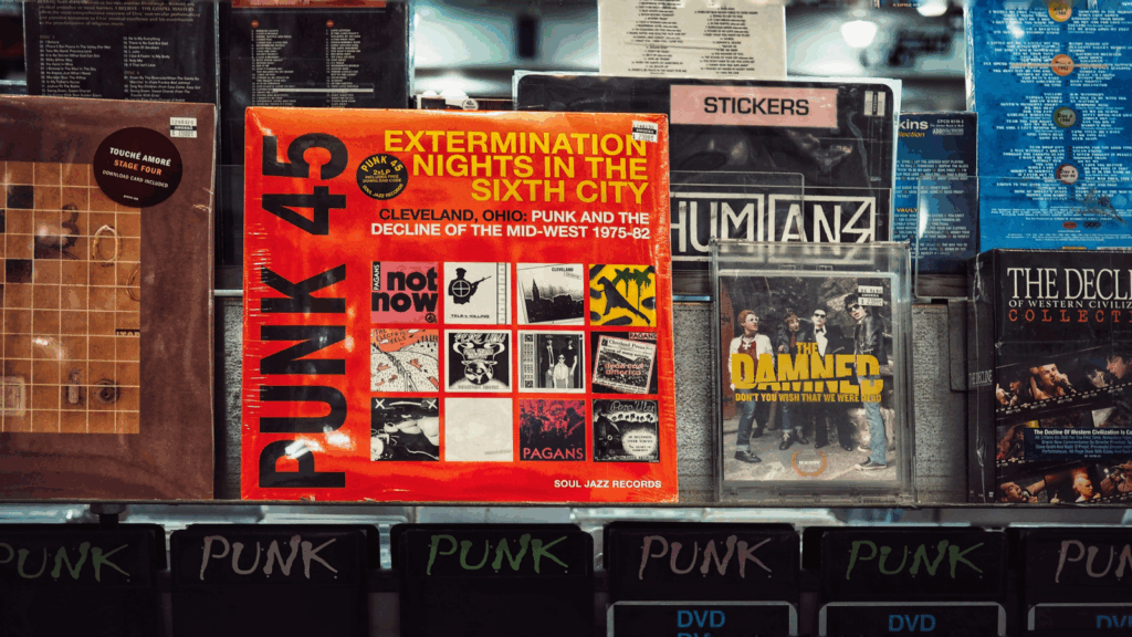 A vibrant display of punk 45 records arranged neatly on shelves in a music store, showcasing various album covers.