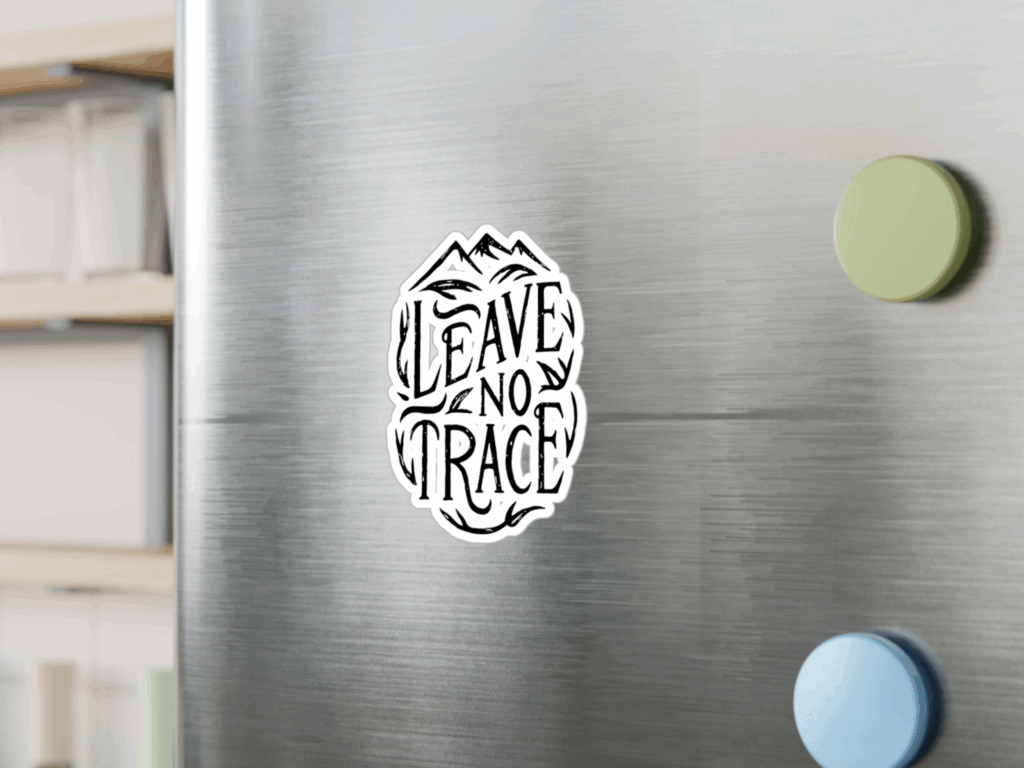 A circular sticker featuring the phrase Leave No Trace with a nature-themed design, promoting environmental responsibility