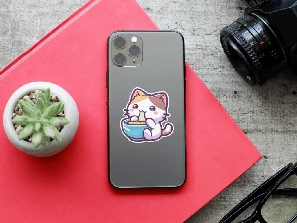 A phone case featuring a playful cat sticker, adding a whimsical touch to the device