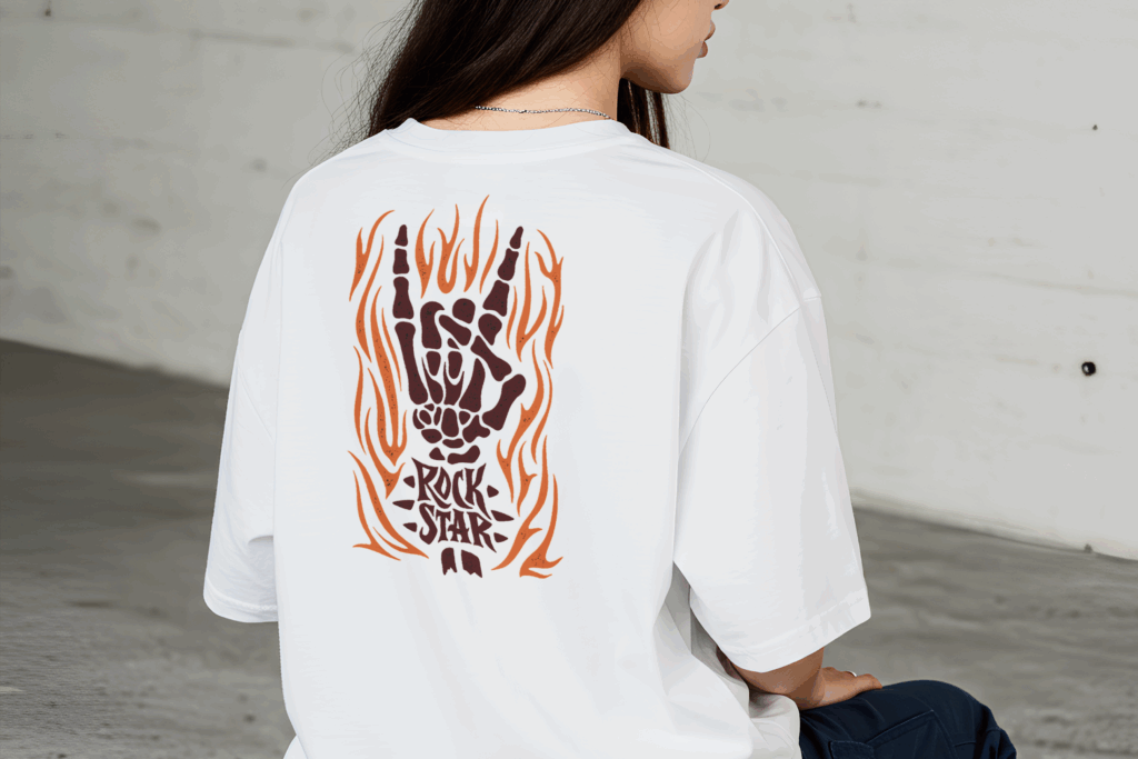 A woman wearing a white t shirt with a fiery hand in a rock gesture and 22Rock Star22 text on the back Blog 6