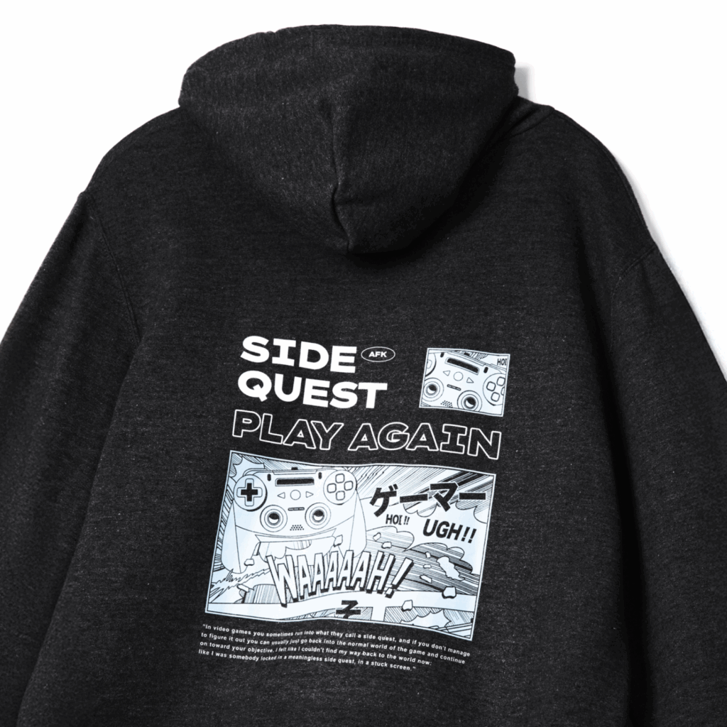 Dark gray hoodie featuring comic-style graphics and text. Print includes "Side Quest," "Play Again" text, and a game controller image.