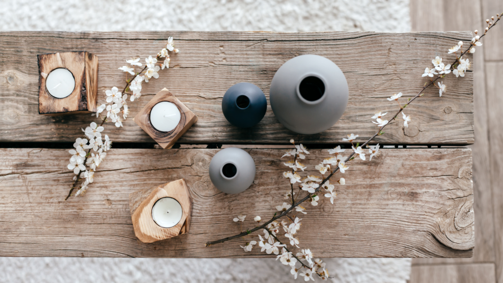 3 Home decor A wooden table adorned with candles and a bouquet of flowers, creating a warm and inviting atmosphere.