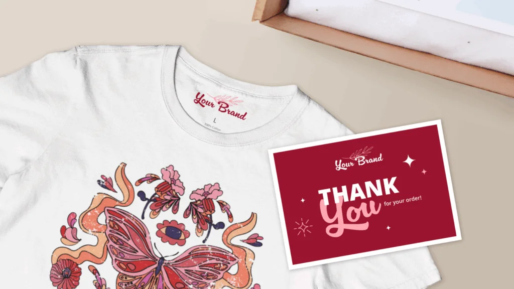 A t-shirt featuring a butterfly design alongside a thank you card, showcasing a blend of nature and gratitude.
