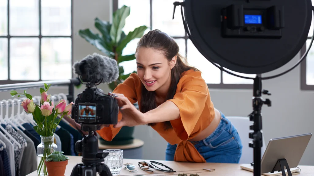  A woman captures a moment with her camera, focusing intently on her subject.