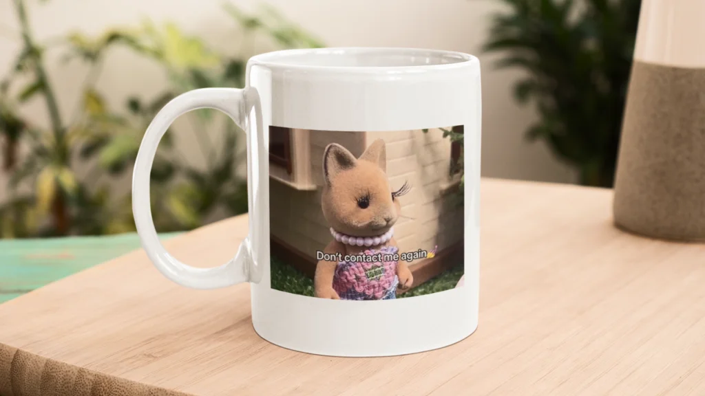 Identity driven hyper niche meme and micro culture designs White mug with a photo of a toy kangaroo wearing a dress and pearl necklace. The text reads "Don't contact me again".