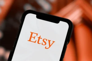An Etsy logo on the phone screen